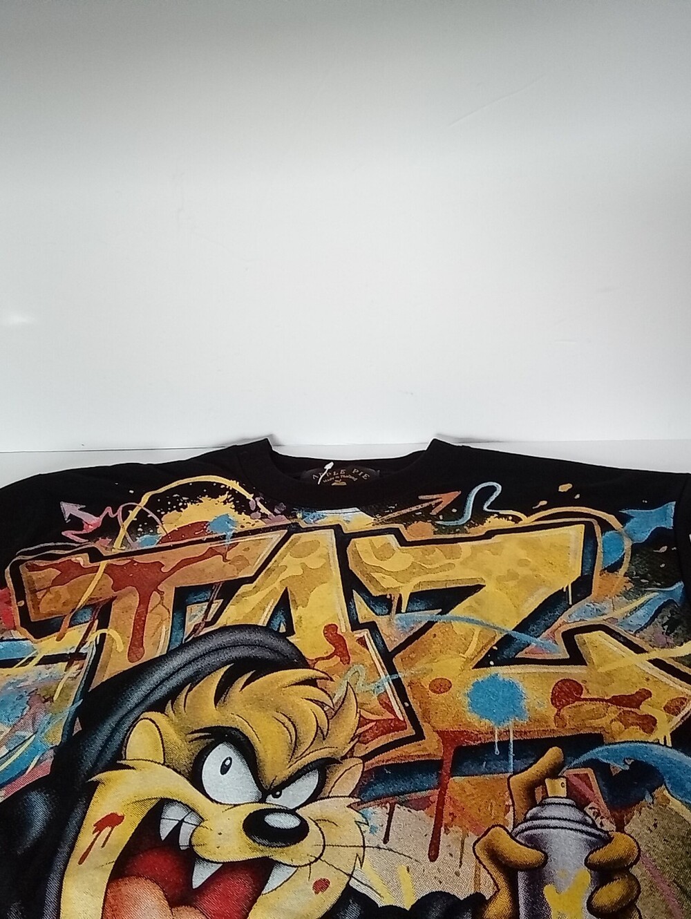 Apple Black Taz AOP Graphic Tee with Gold Logo and Multicolor Front Print - Picture 7 of 10